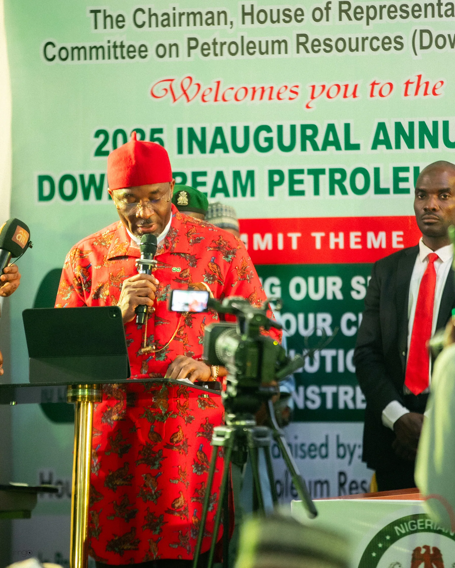 Officials and delegates observing the national anthem at the opening ceremony of the 2025 Downstream Petroleum Week (Day 1) (portrait orientation, suitable for speaker cards)