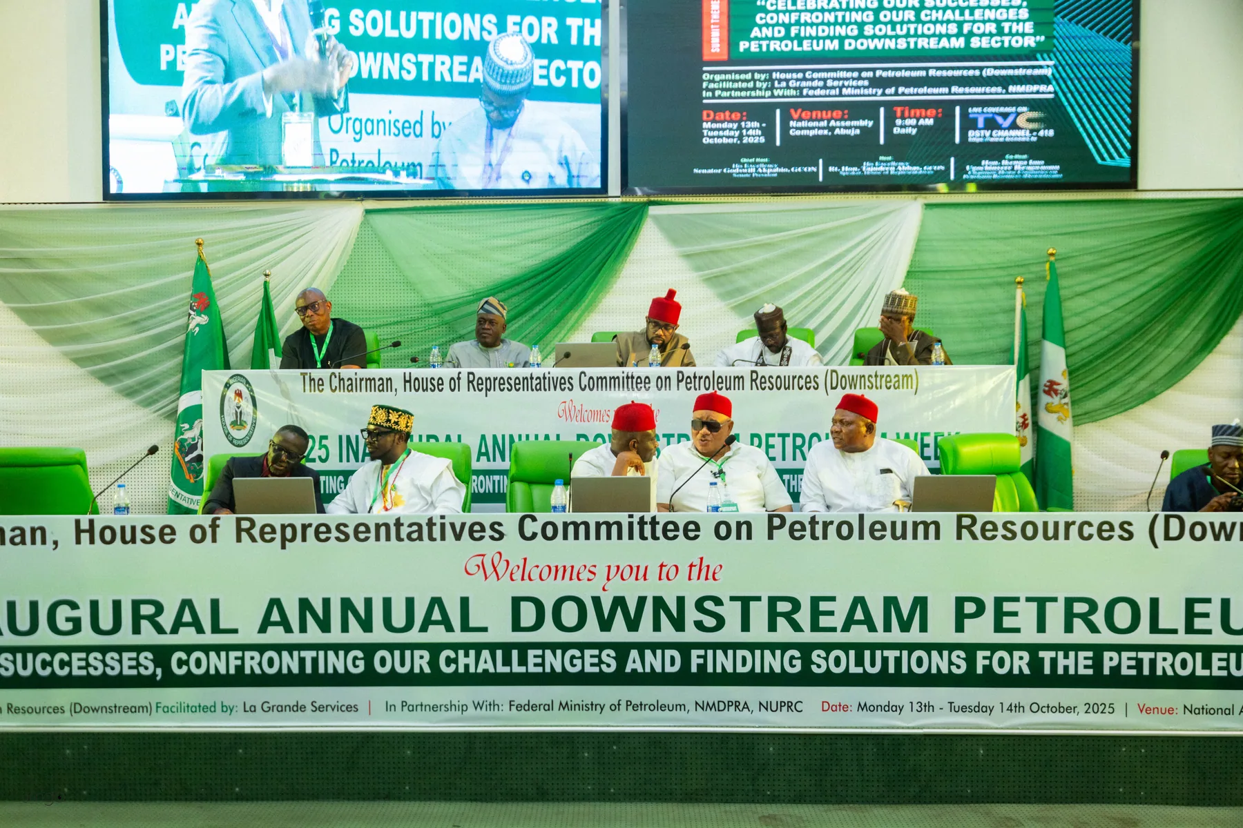 Group photo of stakeholders posing in front of the 2025 Downstream Week branded backdrop (Day 1)